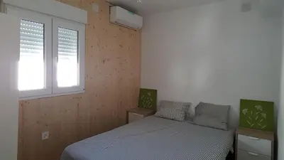 Cama o camas de una habitación en Acogedor apartamento en el barrio del Parlamento de Andalucía (Sevilla)