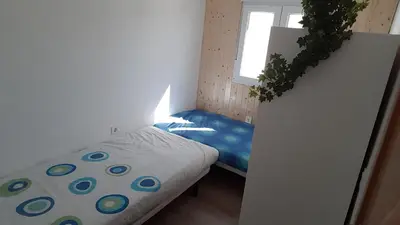 Cama o camas de una habitación en Acogedor apartamento en el barrio del Parlamento de Andalucía (Sevilla)