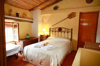 Cama o camas de una habitación en vivienda turistica Fuente Zagrilla II