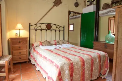 Cama o camas de una habitación en vivienda turistica Fuente Zagrilla II