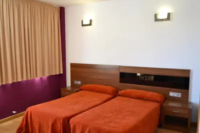 Cama o camas de una habitación en Hotel El Cruce Moraleda
