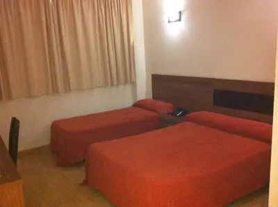 Cama o camas de una habitación en Hotel El Cruce Moraleda