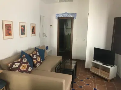 Una televisión o centro de entretenimiento en Apartamento Completo Santa Marina