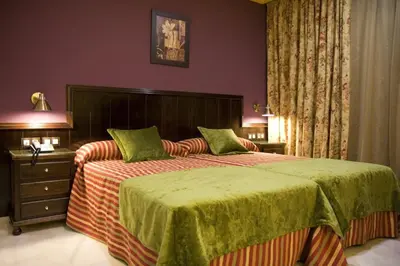 Cama o camas de una habitación en Hotel Las Acacias