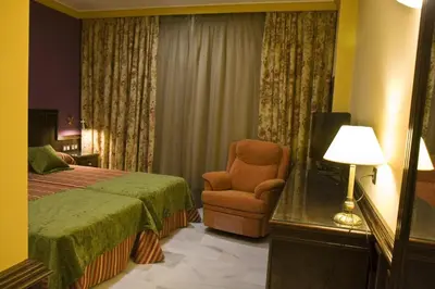 Cama o camas de una habitación en Hotel Las Acacias