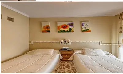 Cama o camas de una habitación en Hotel Sierra de Araceli Lucena