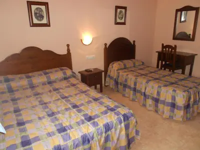 Cama o camas de una habitación en Hostal El Polígono