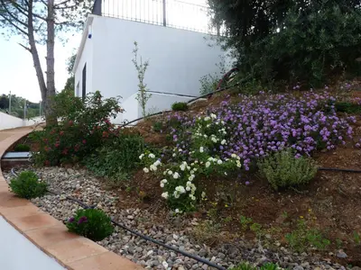 Jardín al aire libre en Casas Rurales el Balcon de la Brena