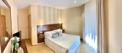 Cama o camas de una habitación en Hotel Fernando IV