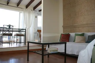 Cama o camas de una habitación en Atico Amistad