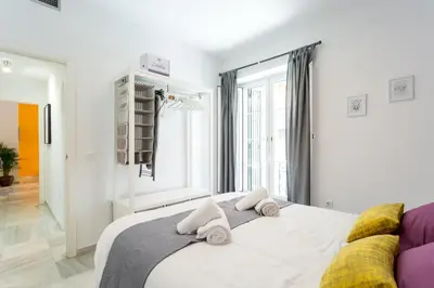 Cama o camas de una habitación en Uniko Home Sevilla