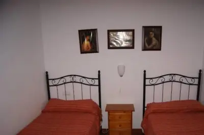 Cama o camas de una habitación en Hostal Alcázar