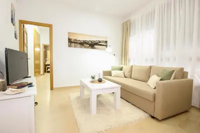 Una televisión o centro de entretenimiento en Apartamento San Julian