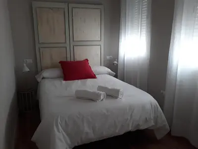 Cama o camas de una habitación en SEVILLA 15