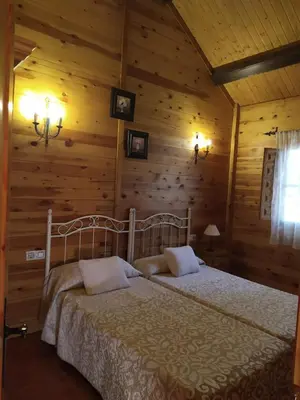 Cama o camas de una habitación en Apartamentos Rurales Sierra Luna