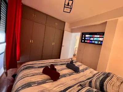 Cama o camas de una habitación en Amplio apartamento familiar con parking privado en pleno centro de Córdoba