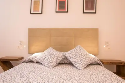 Cama o camas de una habitación en Murallas de Sevilla Apartamento con garaje 4 pax