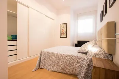 Cama o camas de una habitación en Murallas de Sevilla Apartamento con garaje 4 pax