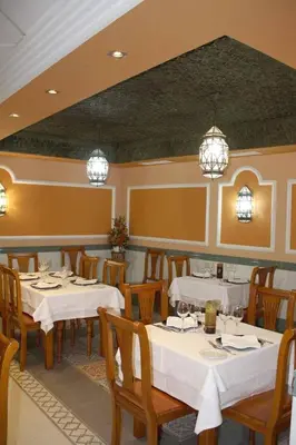 Un restaurante o sitio para comer en Hostal Macami