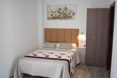 Cama o camas de una habitación en Iznájar Suites