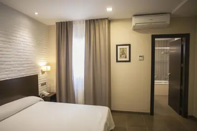 Cama o camas de una habitación en Hotel Restaurante El Corte