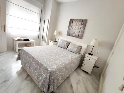 Cama o camas de una habitación en Santa Justa Sevilla Nervion Buhaira Centro