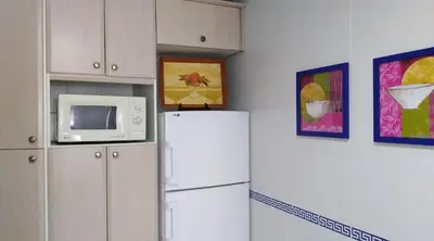 Una cocina o zona de cocina en Alojamiento Regina
