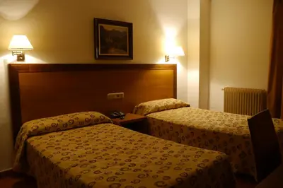 Cama o camas de una habitación en Hotel Torrezaf