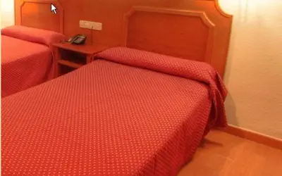 Cama o camas de una habitación en Hotel Torrezaf