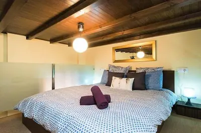 Cama o camas de una habitación en Feria Palace Apartment