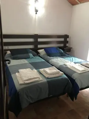 Cama o camas de una habitación en VTAR Don Benito, su casa rural en Gilena