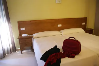 Cama o camas de una habitación en Hotel Gema