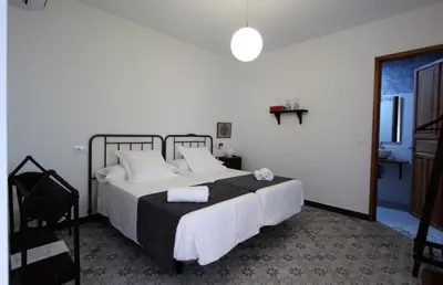 Cama o camas de una habitación en Inés Casa Rural