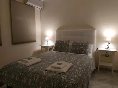 Cama o camas de una habitación en Sevilla Nervión piso con Patio