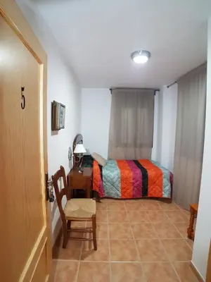 Cama o camas de una habitación en Hostal Mesón La Era