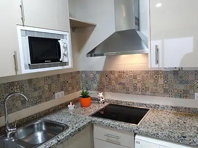 Una cocina o zona de cocina en Alzahira 1