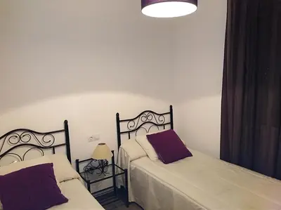 Cama o camas de una habitación en Alzahira 1