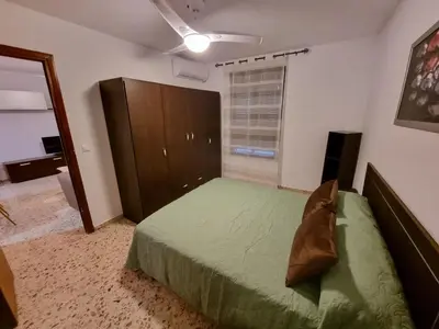 Cama o camas de una habitación en Vivienda Turística en la Muralla de San Basilio