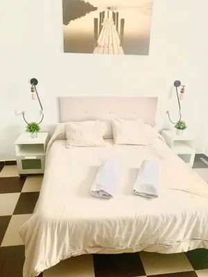 Cama o camas de una habitación en LOS ROSALES