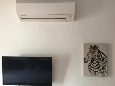 Una televisión o centro de entretenimiento en Apartamento Steven