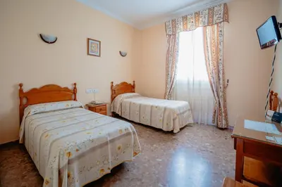 Cama o camas de una habitación en Hotel Chamizo