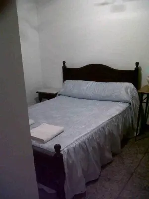 Cama o camas de una habitación en Hostal Medina
