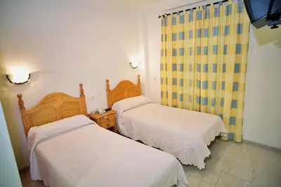 Cama o camas de una habitación en Hostal Restaurante Hermanos Zamora