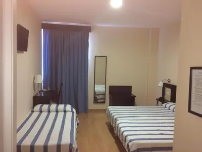 Cama o camas de una habitación en Hotel Castillo