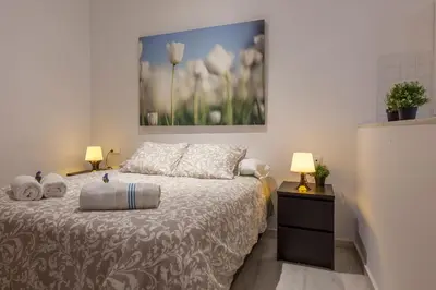 Cama o camas de una habitación en Acogedor apartamento centro Sevilla San Marcos