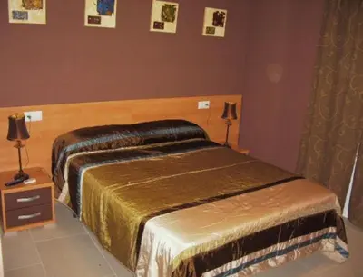 Cama o camas de una habitación en Hostal el mirador
