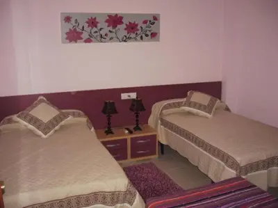 Cama o camas de una habitación en Hostal el mirador
