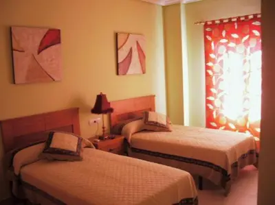 Cama o camas de una habitación en Hostal el mirador