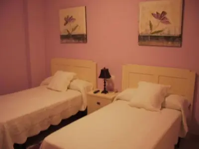 Cama o camas de una habitación en Hostal el mirador