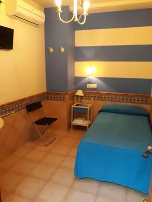 Cama o camas de una habitación en Pension Doña Trinidad